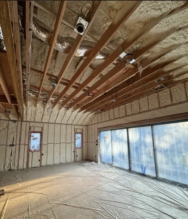 Interior walls and ceiling insulated with spray foam during new construction in Claymont